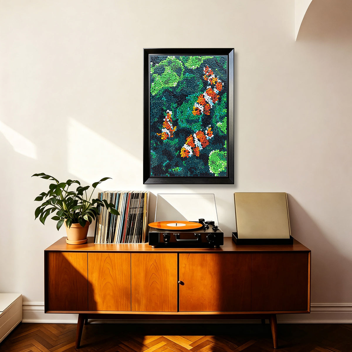 Coral Harmony textured wall art featuring four clownfish displayed in a stylish home interior