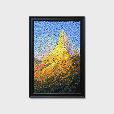 Crowned by Light button art featuring golden mountain peaks illuminated by sunlight, symbolizing good fortune and prosperity