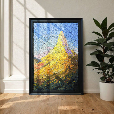 Crowned by Light button art displayed as scenic mountain wall decor in a cozy living room