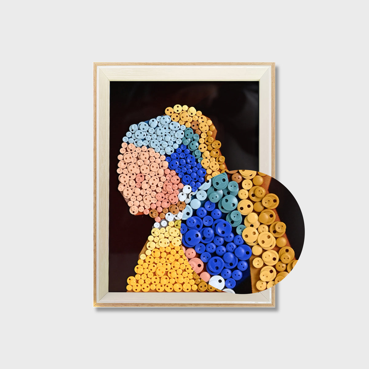 Close-up of Girl with a Pearl Earring button art showing layered buttons and detailed portrait textures