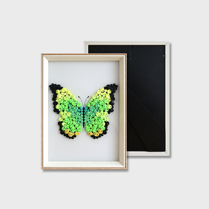 Finished Green Butterfly button art featuring a vibrant green butterfly