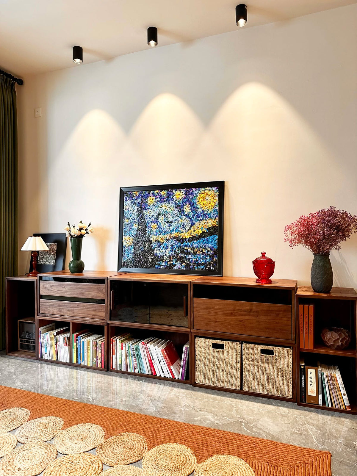 Collection of small and large button art pieces displayed together as home wall decor
