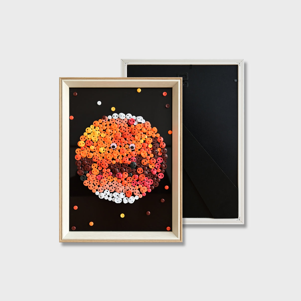Finished Mars button art showing a red textured planet design with playful button eyes