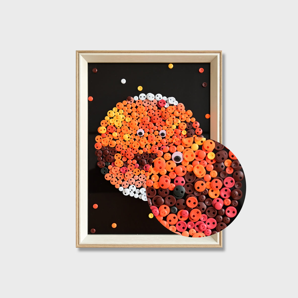 Close-up of Mars button art showing red buttons, textured details, and decorative button eyes