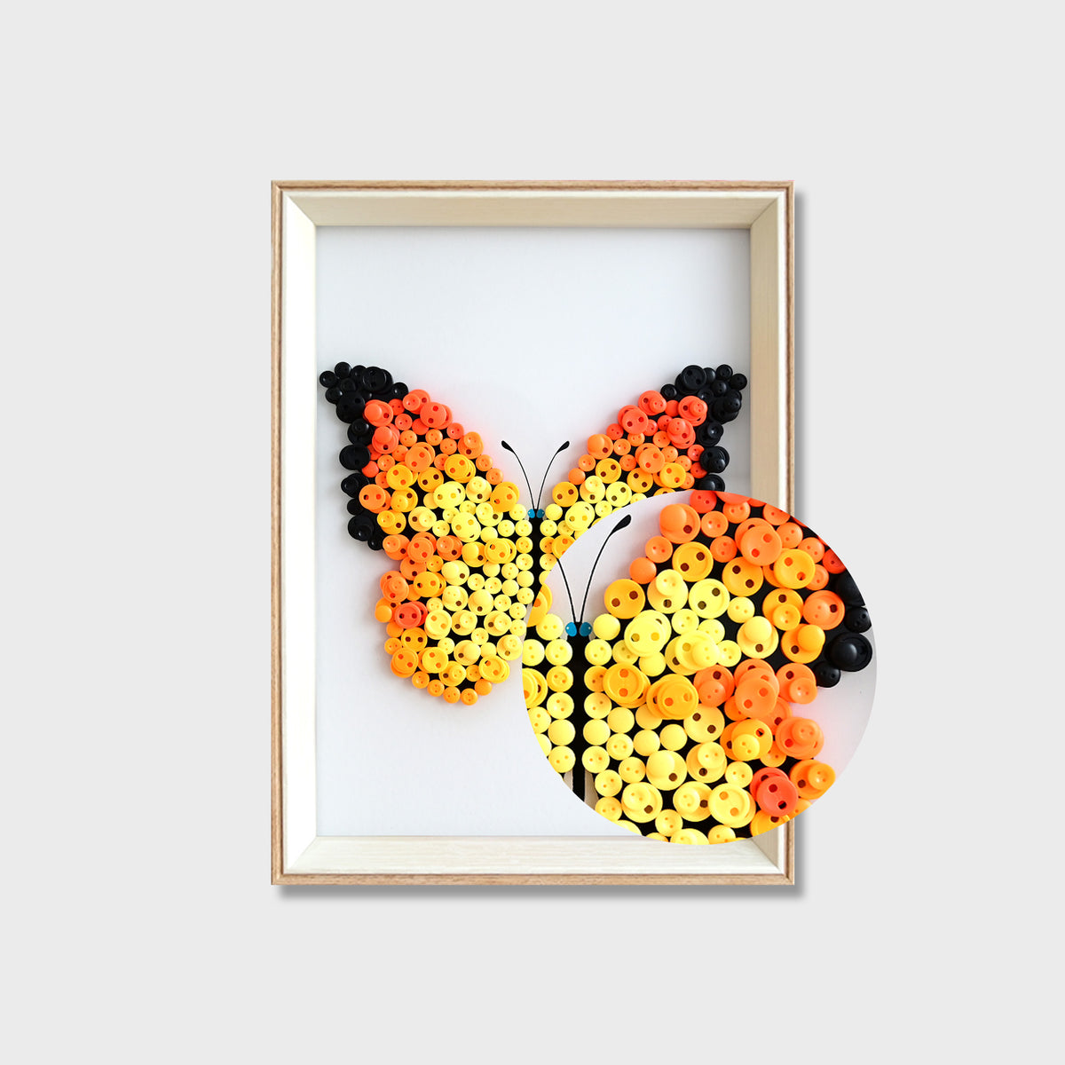 Close-up of Orange Butterfly button art showing layered orange buttons and detailed wing textures
