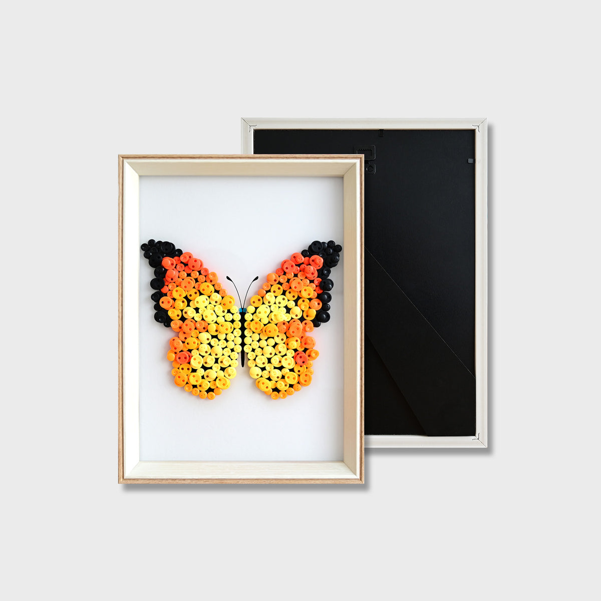 Finished Orange Butterfly button art featuring a vibrant orange butterfly