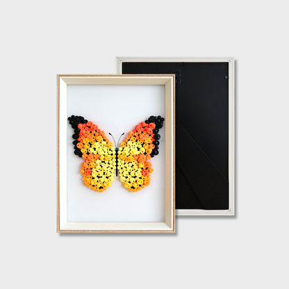 Finished Orange Butterfly button art featuring a vibrant orange butterfly