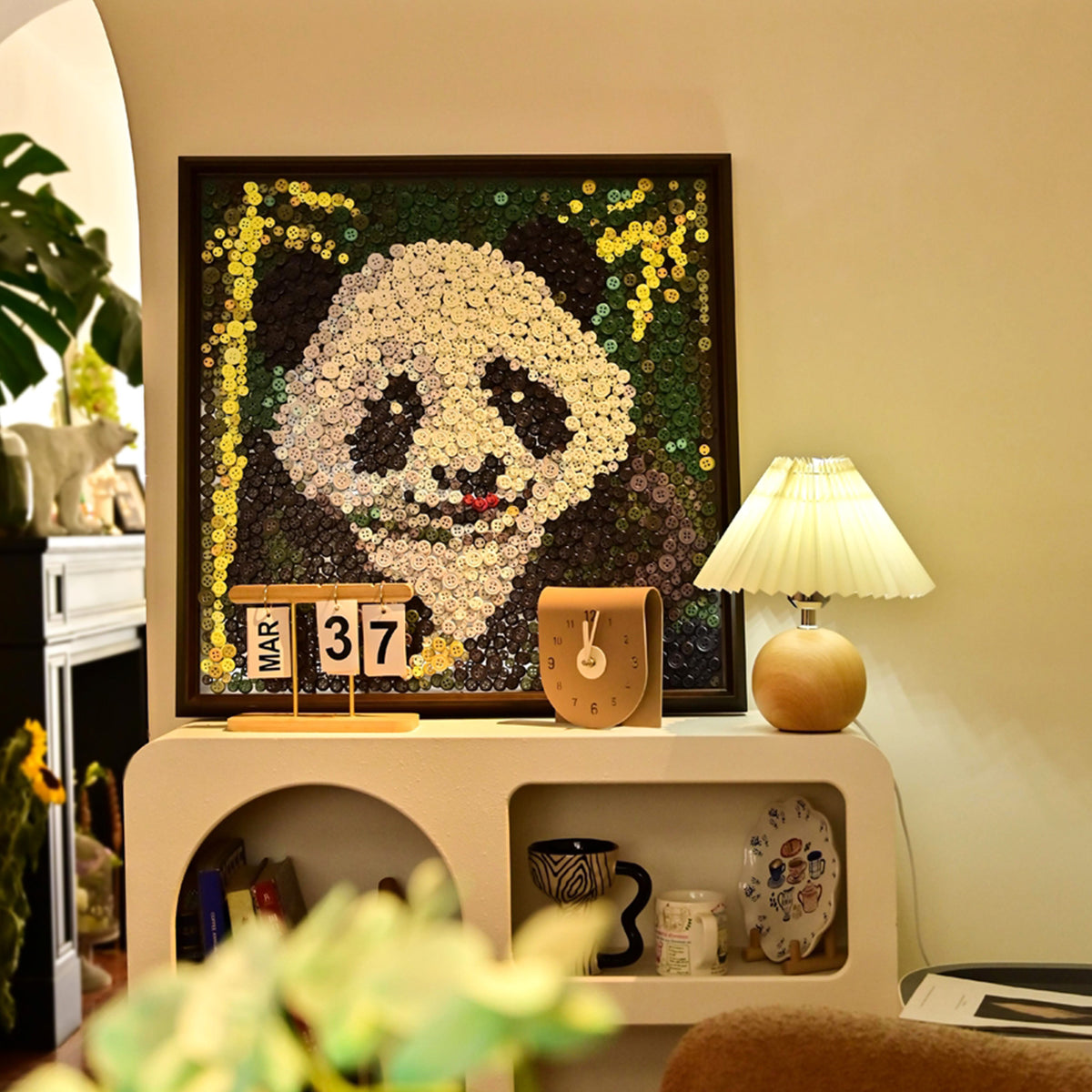 Panda textured button artwork featuring a cute panda resting beside bamboo displayed as distinctive nature-inspired wall decor in a contemporary home