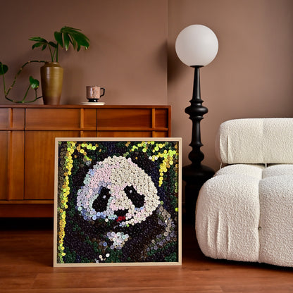 Panda button art displayed as statement animal wall decor in a modern interior