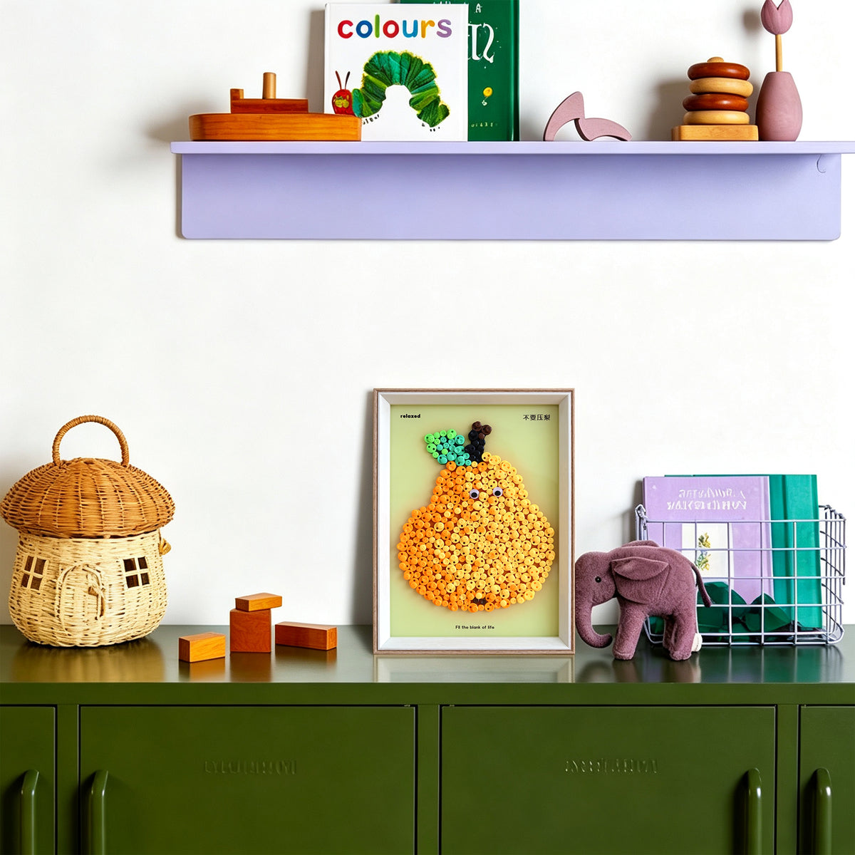 Pear button art displayed as colorful wall decor in a cozy living room