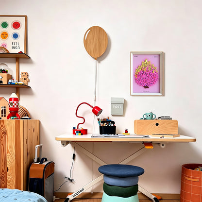 Pitaya button artwork adding a vibrant pink artistic touch to a room