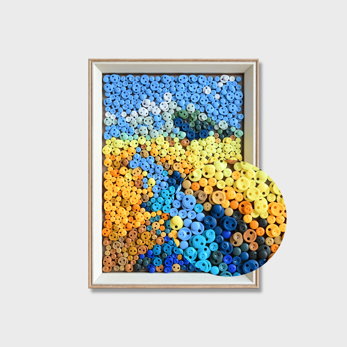 Close-up of River button art showing blue buttons forming a flowing river through golden wheat fields beneath a textured blue sky