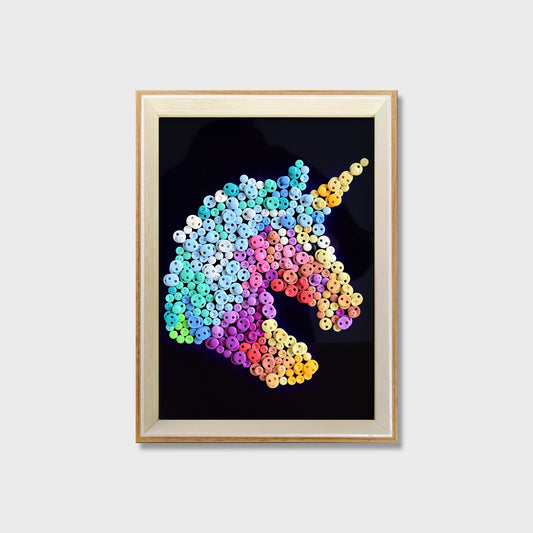 Unicorn button art kit featuring a colorful unicorn with a blue and white mane on a black background
