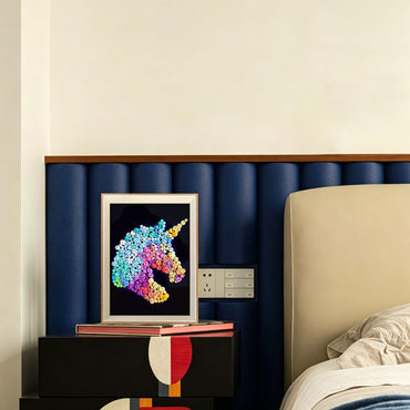 Unicorn button art displayed as colorful wall decor in a cozy living room